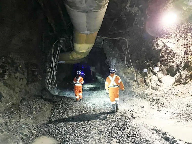 Two miners underground at the Fox Complex